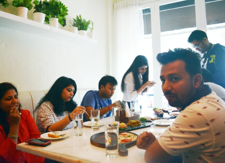 Food bloggers reviewing J2 Kitchen & Bar in Rajouri Garden as part of a Restromark marketing campaign